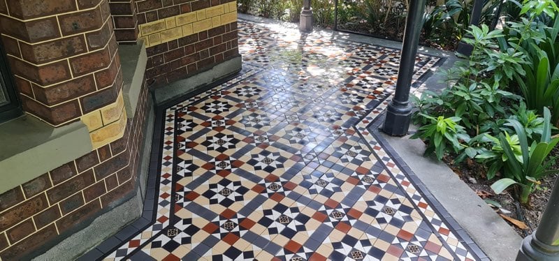 ornate tiled pathway with plants